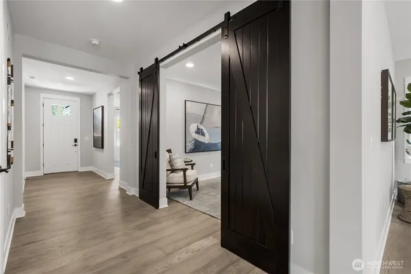 wooden floor with a bathroom