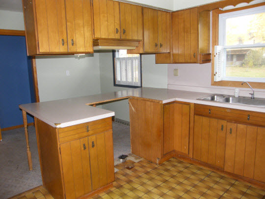 6936 South Sarah Avenue Rochelle, IL 61068 - Photo 4 of 10 a kitchen with stainless steel appliances granite countertop a sink window and cabinets