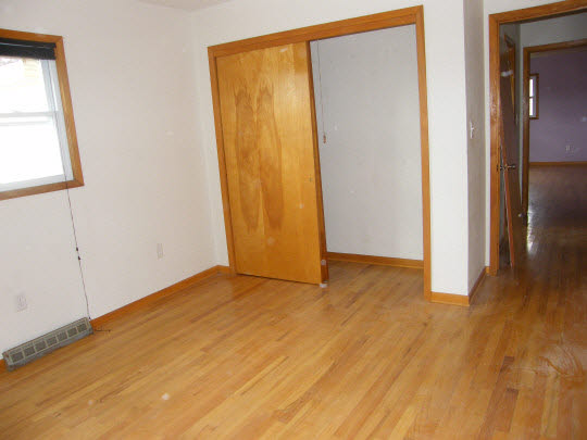 6936 South Sarah Avenue Rochelle, IL 61068 - Photo 7 of 10 a view of an empty room with closet and a window