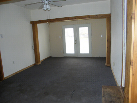6936 South Sarah Avenue Rochelle, IL 61068 - Photo 8 of 10 an empty room with windows and fan