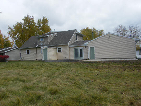 6936 South Sarah Avenue Rochelle, IL 61068 - Photo 10 of 10 a house with green field in front of it