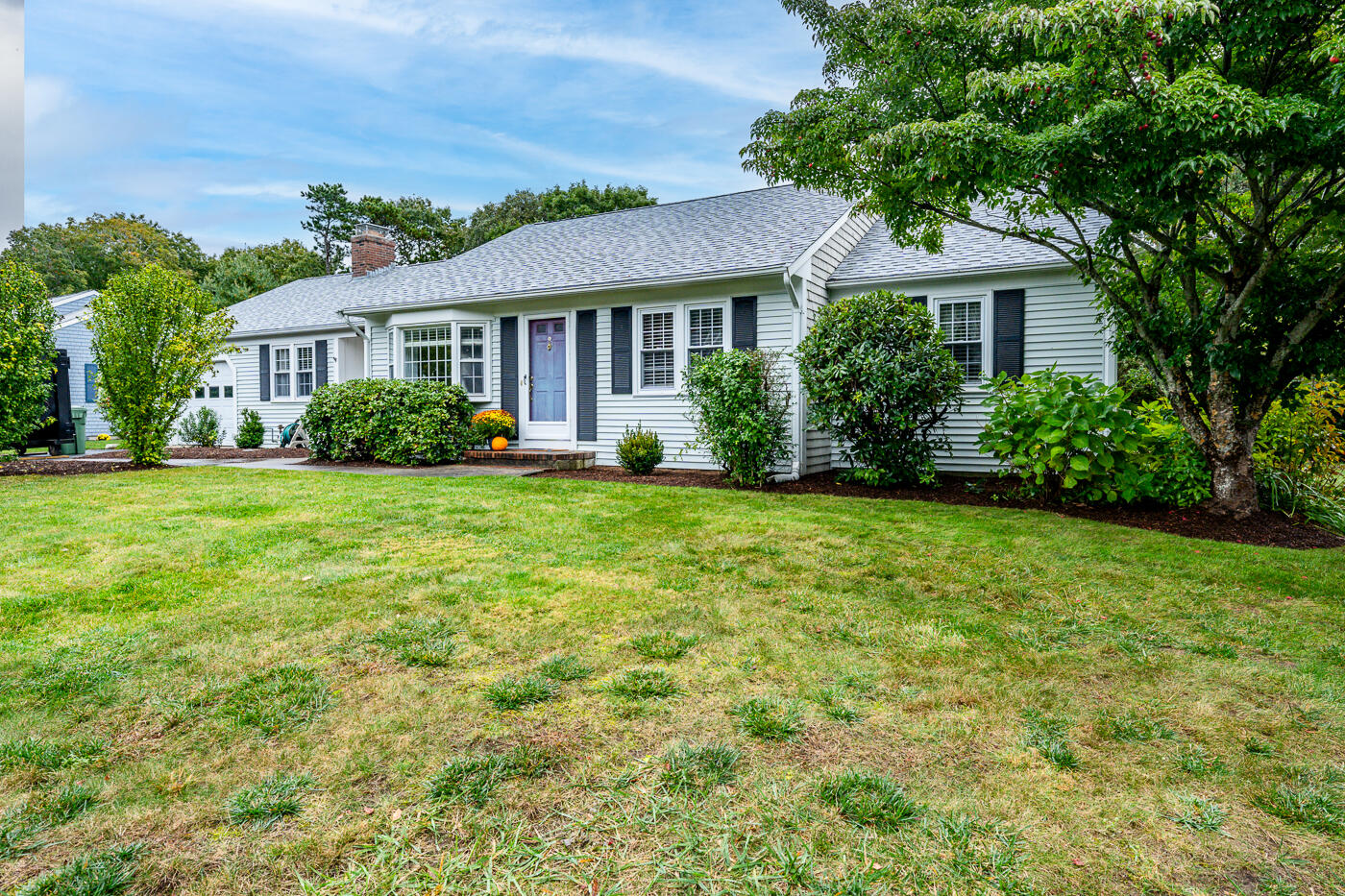 348 Prince Hinckley Road Centerville, MA 02632 - Photo 1 of 31 a view of a house next to a yard with plants and trees