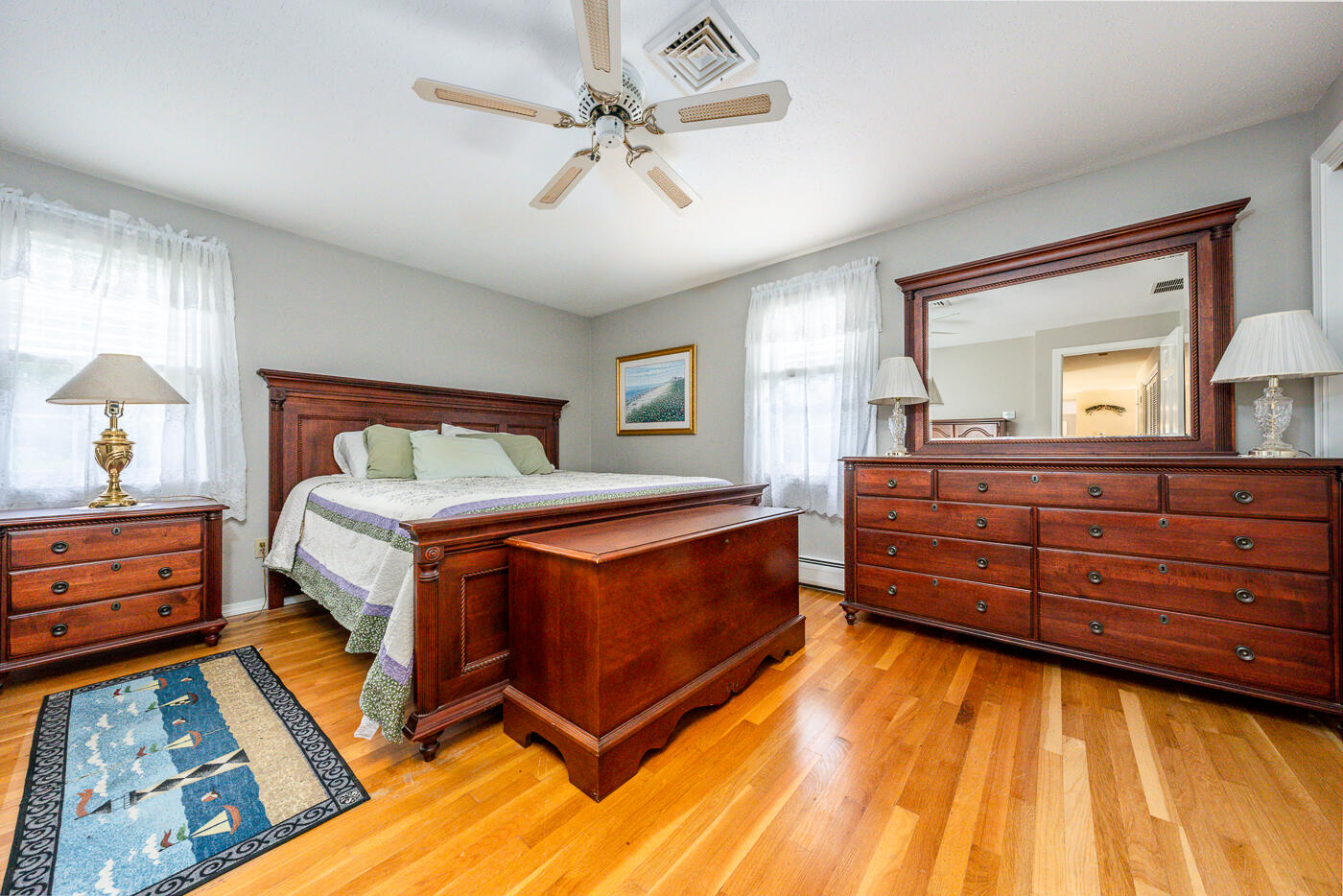 348 Prince Hinckley Road Centerville, MA 02632 - Photo 15 of 31 a bed room with a bed and a dresser