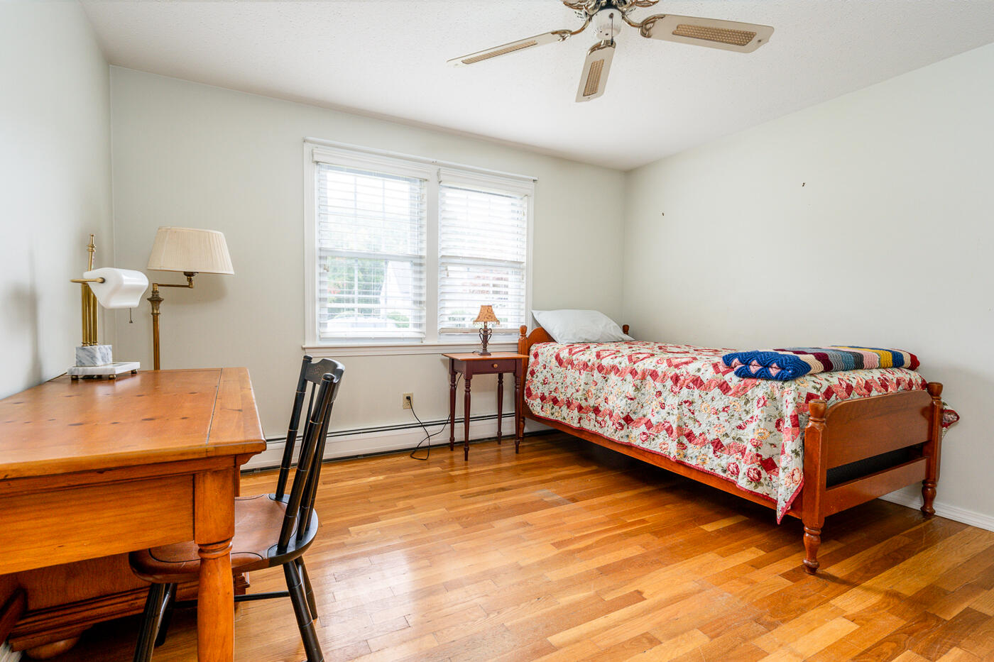 348 Prince Hinckley Road Centerville, MA 02632 - Photo 20 of 31 a bedroom with a bed and a table chair