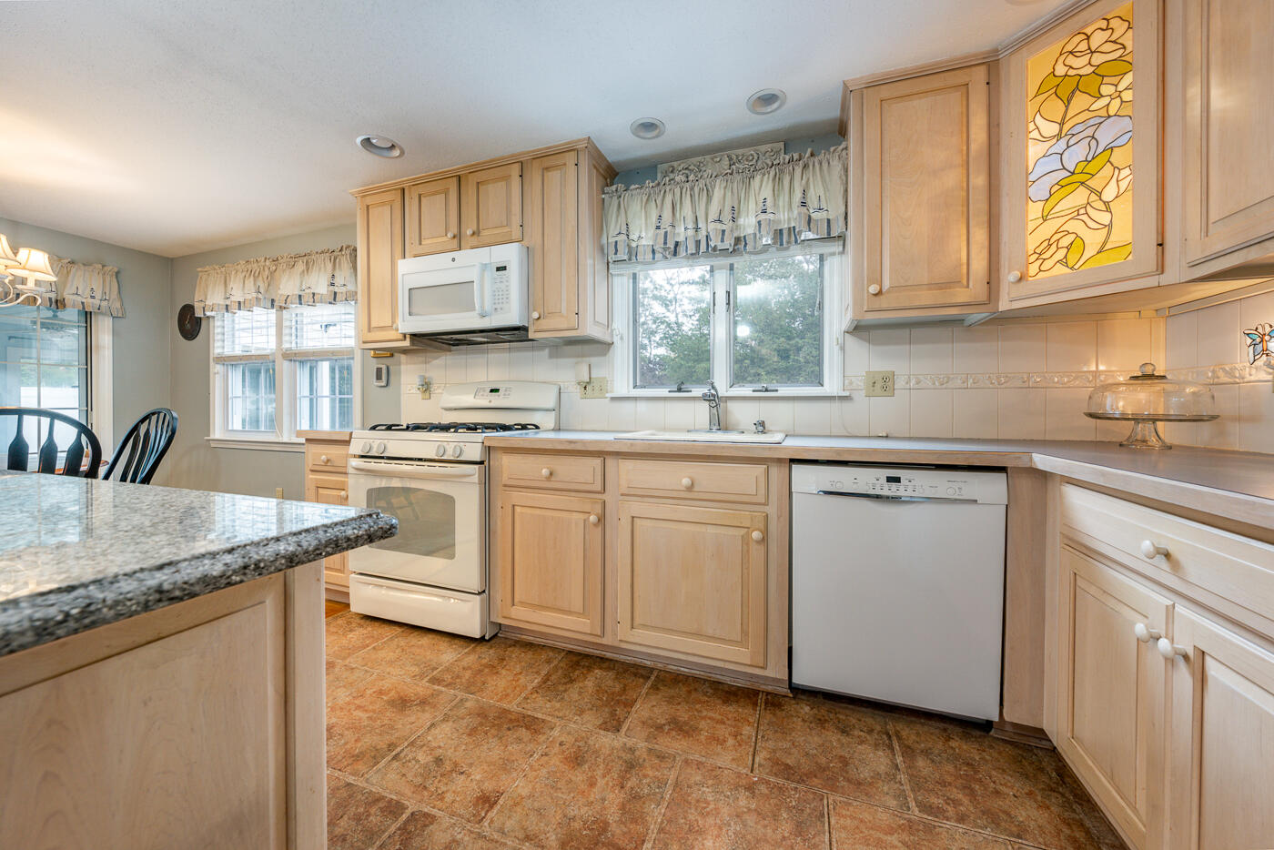 348 Prince Hinckley Road Centerville, MA 02632 - Photo 5 of 31 a kitchen with granite countertop cabinets stainless steel appliances a sink and a window