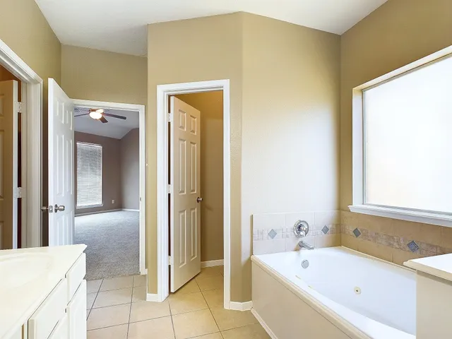 a bathroom with a bathtub and a shower