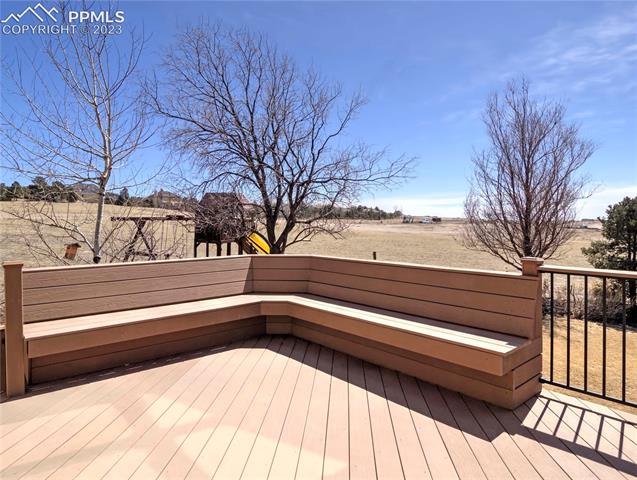 1165 Bowstring Road Monument, CO 80132 - Photo 26 of 27 Built-in bench provides extra deck seating