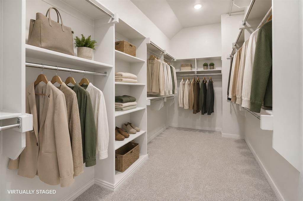 421 Matchbox Street Argyle, TX 76226 - Photo 21 of 40 Spacious walk-in closet featuring light-toned carpeting, extensive built-in shelving, multiple hanging rods, recessed ceiling lighting, and white baseboards