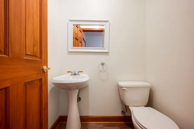 a house with a big yard and large trees