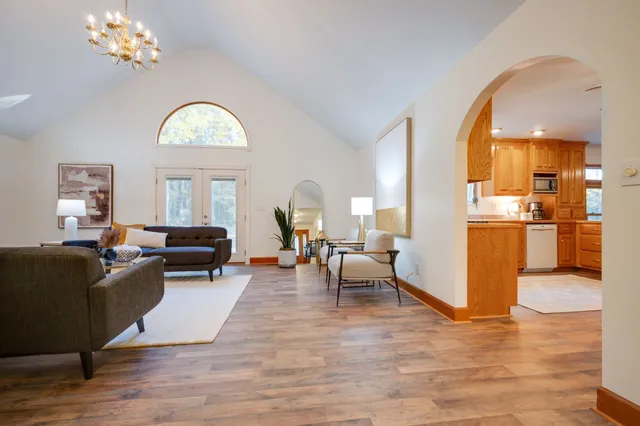 a living room with furniture dining table and a fireplace