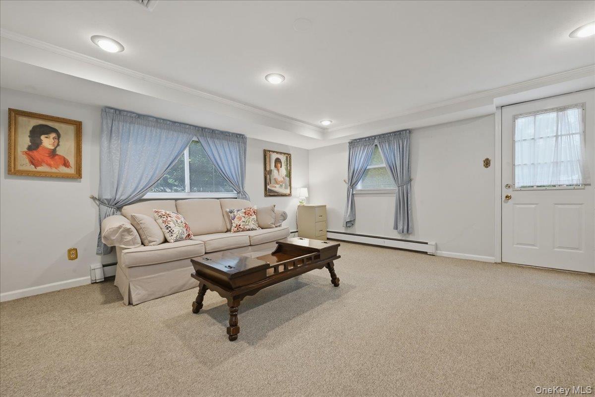 17 Avon Road Farmingdale, NY 11735 - Photo 25 of 46 a living room with furniture and a window