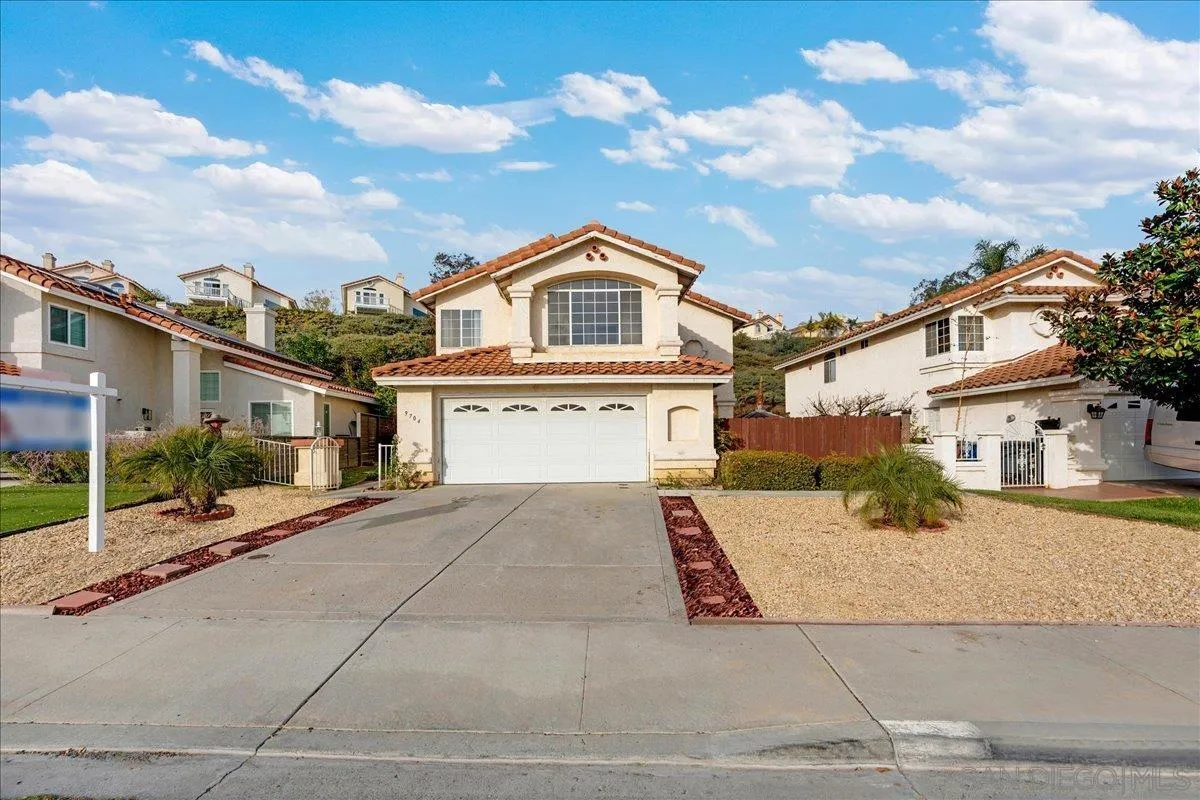 9704 Avenida Ricardo Spring Valley, CA 91977 - Photo 45 of 52 a front view of a house with a yard and garage