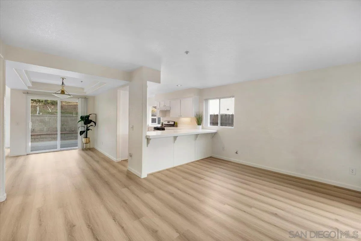 9704 Avenida Ricardo Spring Valley, CA 91977 - Photo 7 of 52 a view of a kitchen with wooden floor and a sink