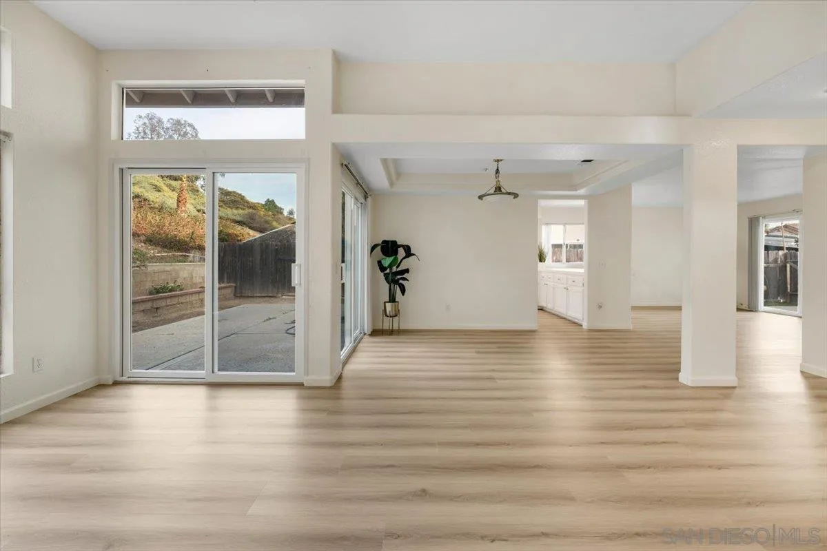 9704 Avenida Ricardo Spring Valley, CA 91977 - Photo 8 of 52 a view of a room with wooden floor and windows