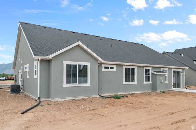 1869 South 2425 West Ogden, UT 84401 - Photo 2 of 22 Back of property featuring roof with shingles and stucco siding