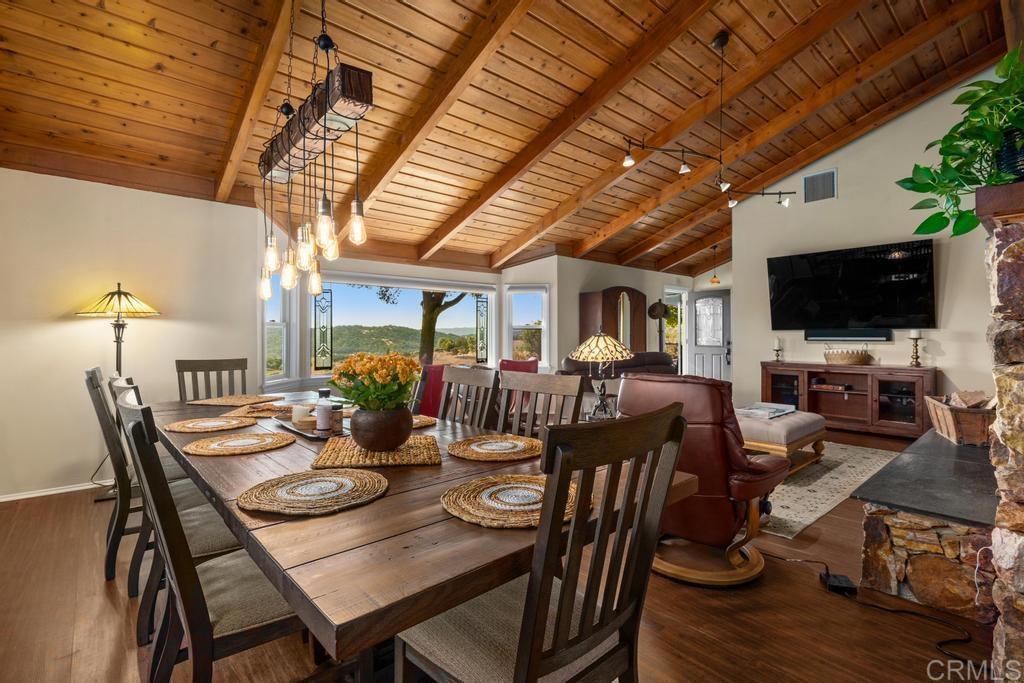 25443 Mesa Grande Road Santa Ysabel, CA 92070 - Photo 20 of 68 a view of a dining room with furniture window and wooden floor