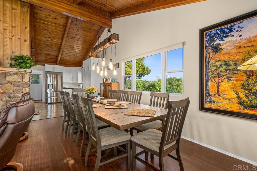 25443 Mesa Grande Road Santa Ysabel, CA 92070 - Photo 22 of 68 a view of a dining room with furniture window and wooden floor