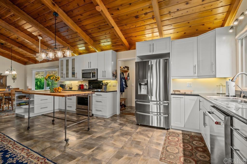 25443 Mesa Grande Road Santa Ysabel, CA 92070 - Photo 23 of 68 a kitchen with stainless steel appliances granite countertop a refrigerator and a stove top oven