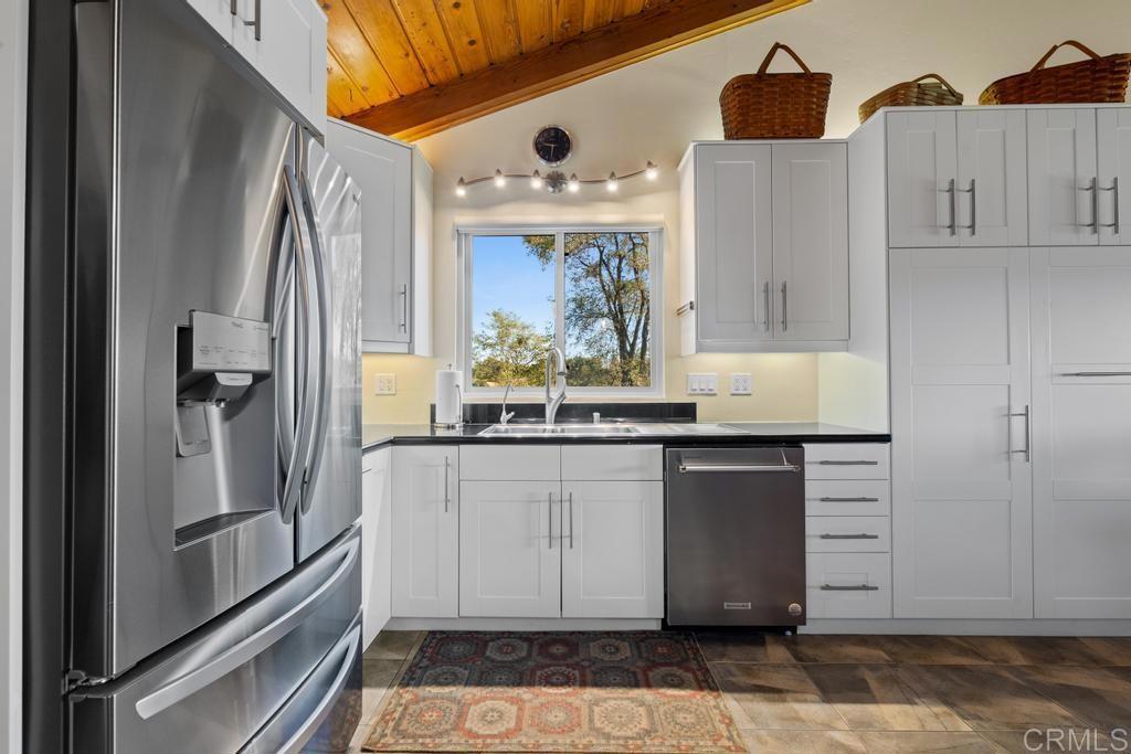 25443 Mesa Grande Road Santa Ysabel, CA 92070 - Photo 24 of 68 a kitchen with stainless steel appliances granite countertop a refrigerator and a sink