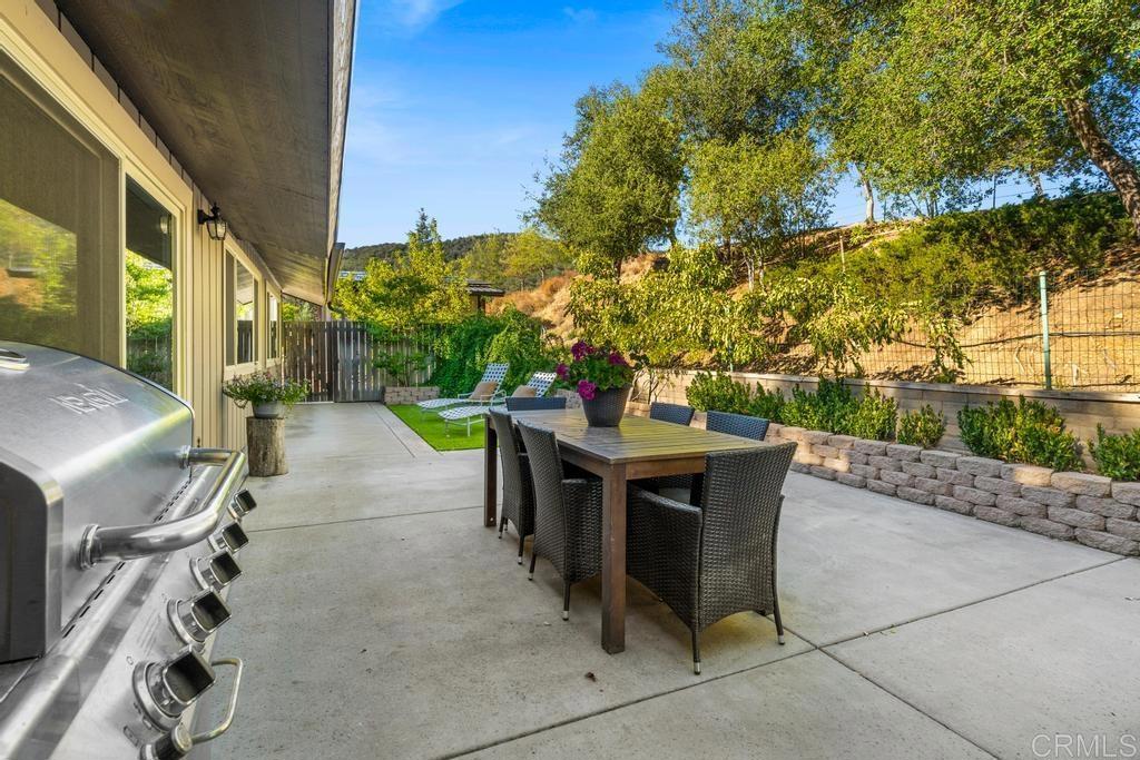 25443 Mesa Grande Road Santa Ysabel, CA 92070 - Photo 28 of 68 a view of a patio with table and chairs and potted plants