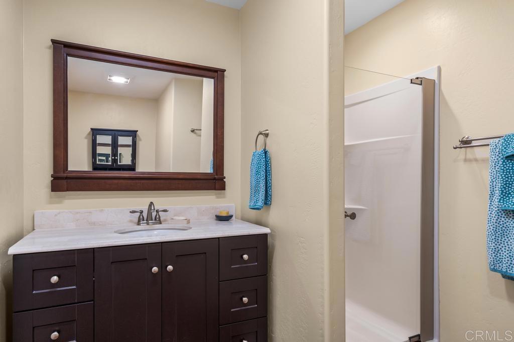 25443 Mesa Grande Road Santa Ysabel, CA 92070 - Photo 31 of 68 a bathroom with a vanity and a mirror
