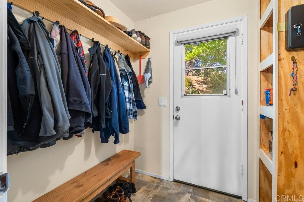 25443 Mesa Grande Road Santa Ysabel, CA 92070 - Photo 39 of 68 a view of walk in closet with clothes and shoes