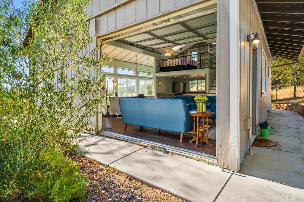 25443 Mesa Grande Road Santa Ysabel, CA 92070 - Photo 47 of 68 a view of a porch with a table and chairs and potted plants