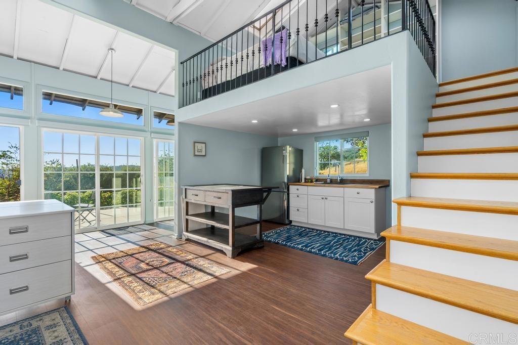 25443 Mesa Grande Road Santa Ysabel, CA 92070 - Photo 49 of 68 a room with stairs and a wooden floor