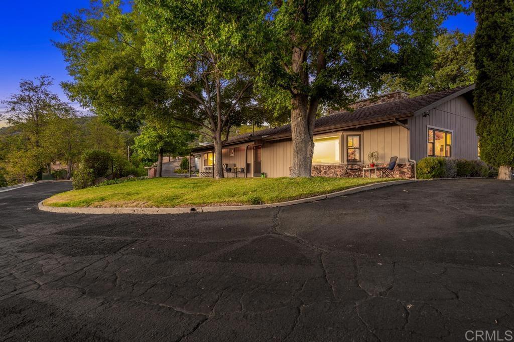 25443 Mesa Grande Road Santa Ysabel, CA 92070 - Photo 65 of 68 a view of a house with a yard and garage