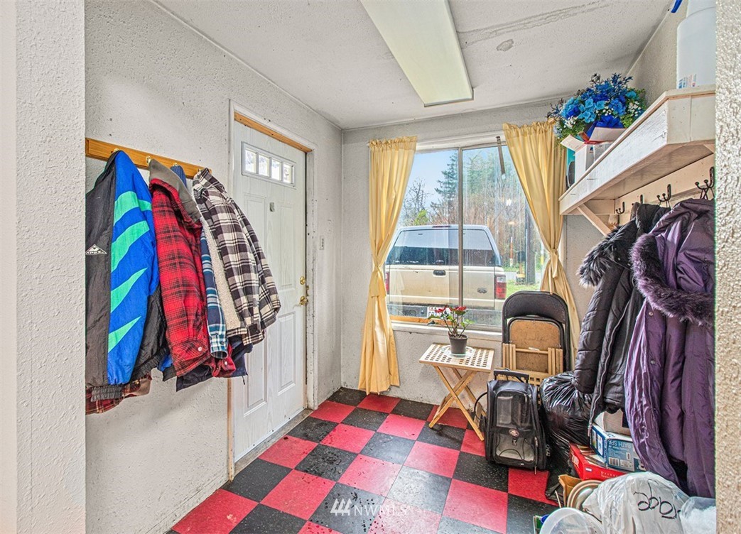 20128 Carper Road Southwest Rochester, WA 98579 - Photo 17 of 19 a view of walk in closet with clothes and shoes