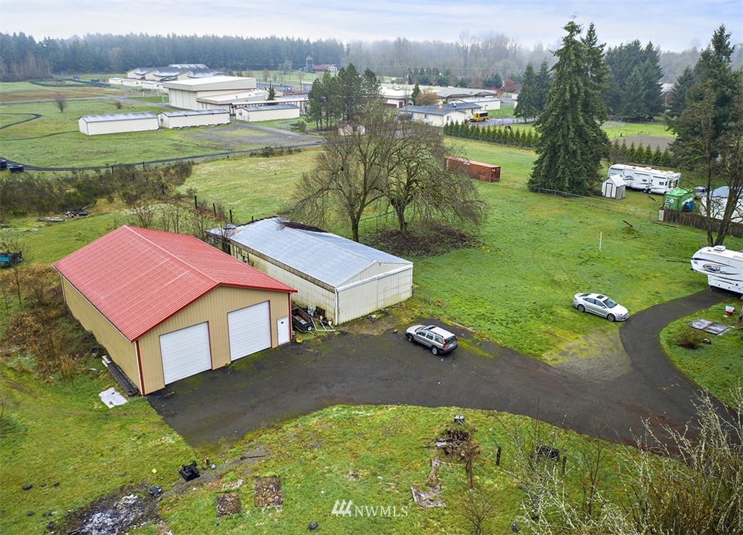 20128 Carper Road Southwest Rochester, WA 98579 - Photo 4 of 19 aerial view of a house with yard and lake view