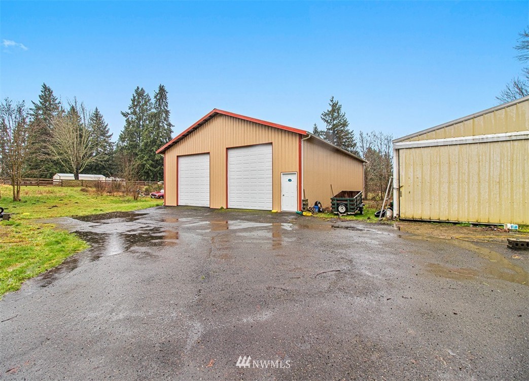 20128 Carper Road Southwest Rochester, WA 98579 - Photo 5 of 19 a view of a house with backyard and trees