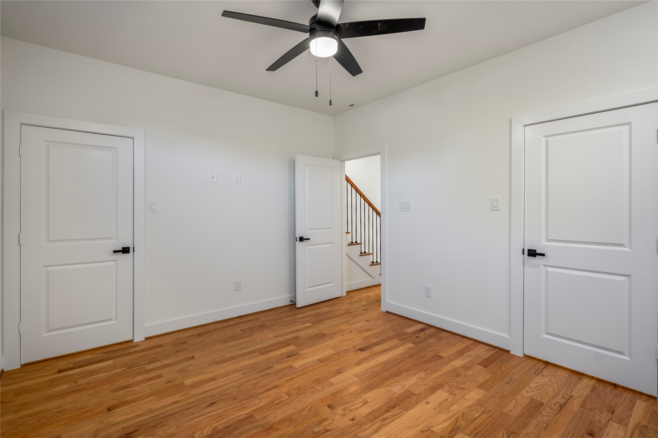 6324 Del Rio Street Houston, TX 77021 - Photo 6 of 50 a view of empty room with wooden floor and ceiling fan
