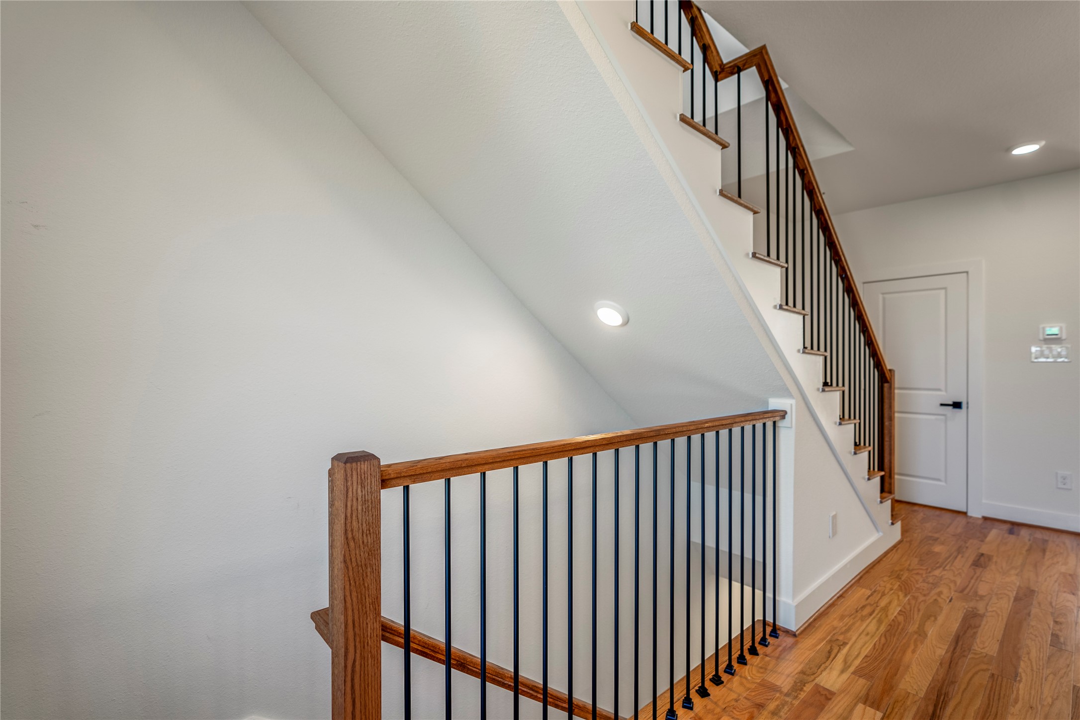 6324 Del Rio Street Houston, TX 77021 - Photo 8 of 50 a view of staircase with railing and white walls