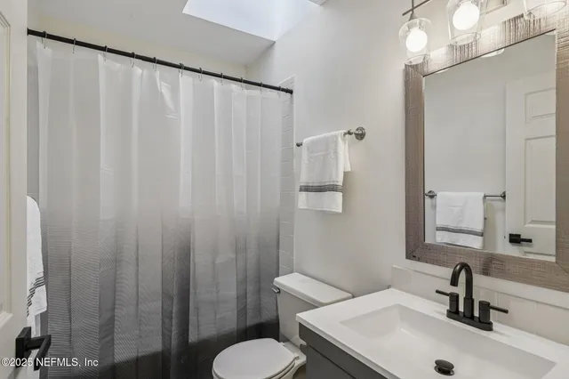 an aerial view of beach and tree