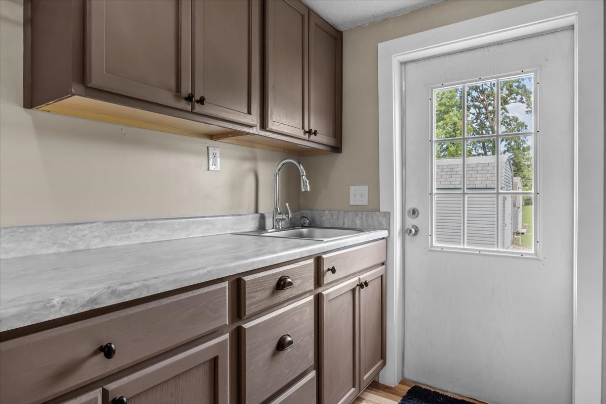 1112 Garners Creek Road Dickson, TN 37055 - Photo 18 of 57 a kitchen with granite countertop cabinets stainless steel appliances and sink