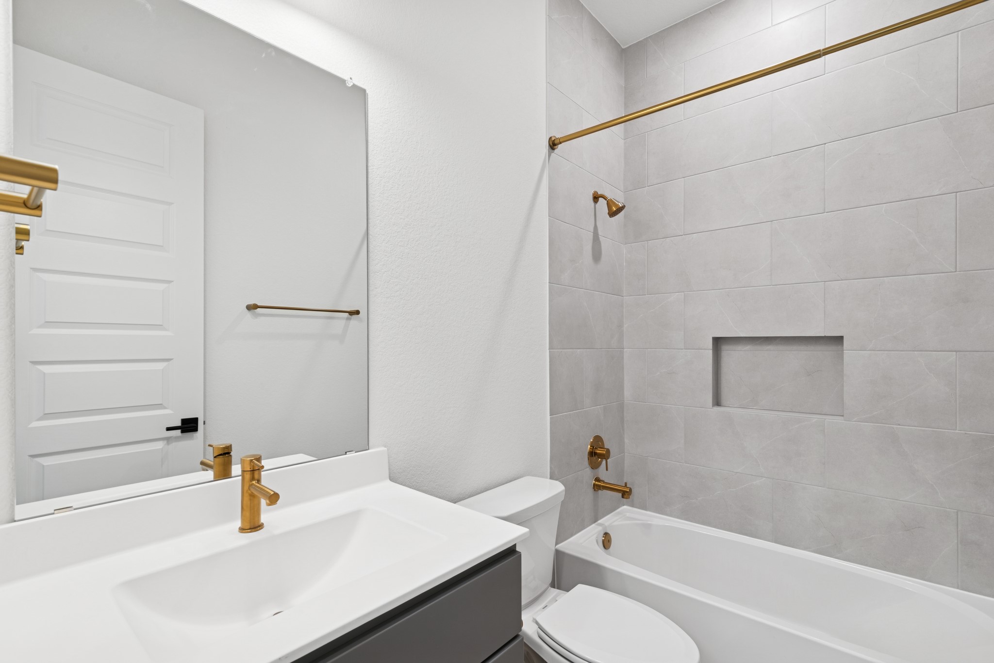 16138 Rita Road Conroe, TX 77302 - Photo 20 of 50 a bathroom with a sink toilet and shower