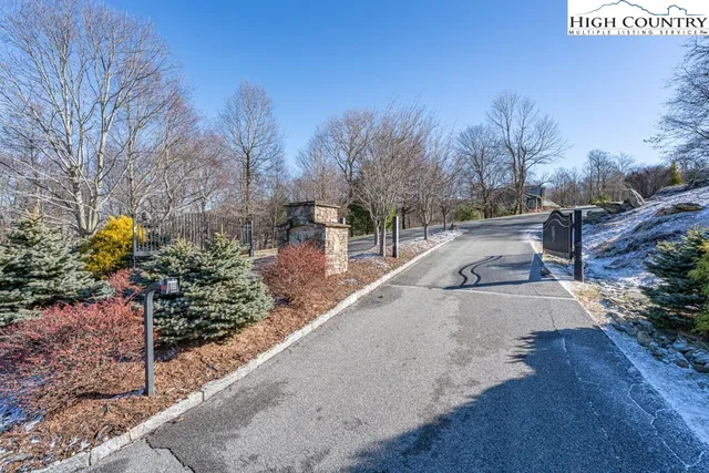 a view of a backyard with sitting area