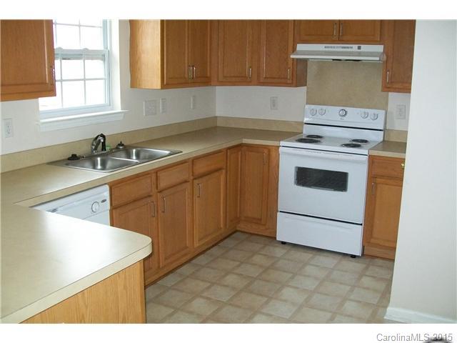640 Cliffs Inn Circle Charlotte, NC 28214 - Photo 2 of 11 a kitchen with a sink stove and cabinets