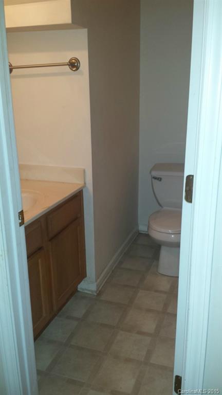640 Cliffs Inn Circle Charlotte, NC 28214 - Photo 11 of 11 a bathroom with a toilet and a sink