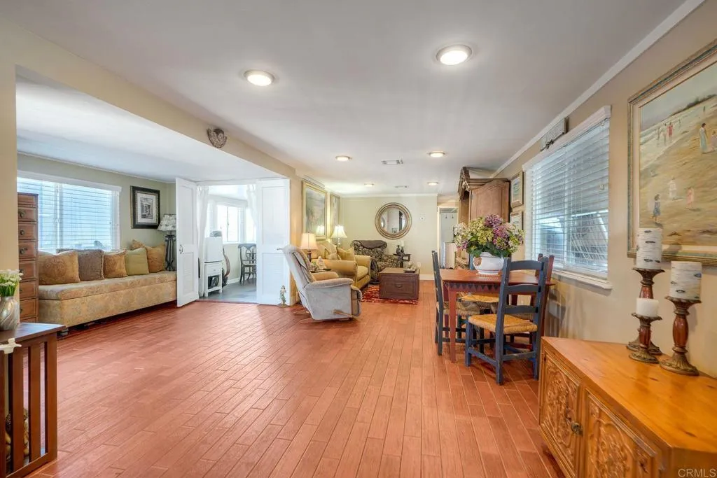6550 Ponto, Unit 78 Carlsbad, CA 92011 - Photo 5 of 33 a living room with furniture and a wooden floor