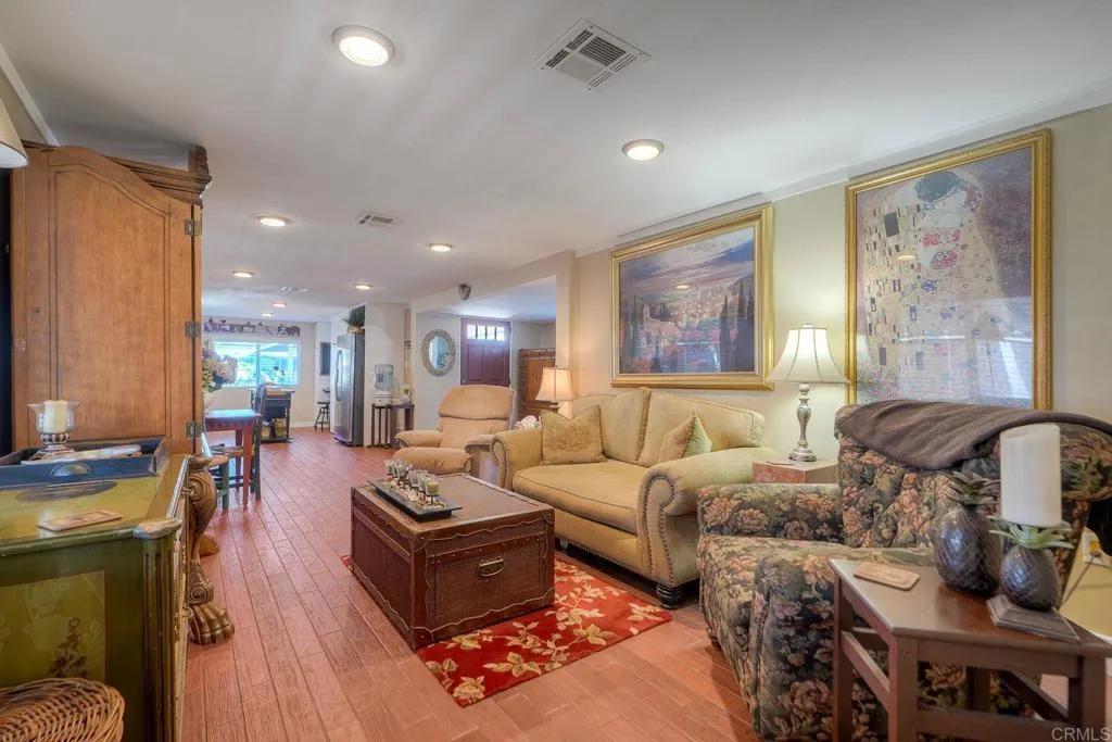 6550 Ponto, Unit 78 Carlsbad, CA 92011 - Photo 8 of 33 a living room with furniture fireplace and a window