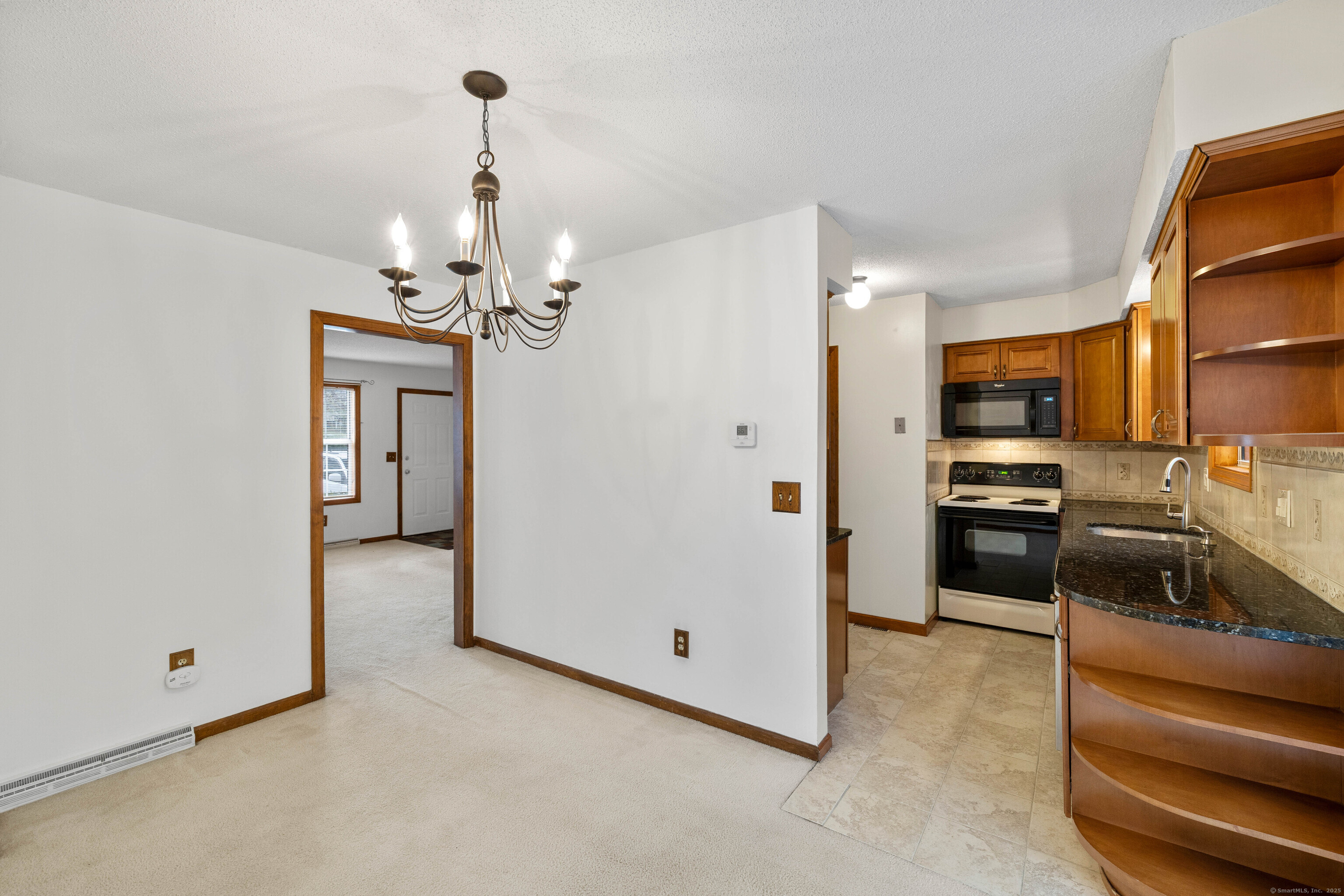 226 Austin Ryer Lane, Unit 226 Branford, CT 06405 - Photo 13 of 34 a view of a kitchen with a sink and refrigerator