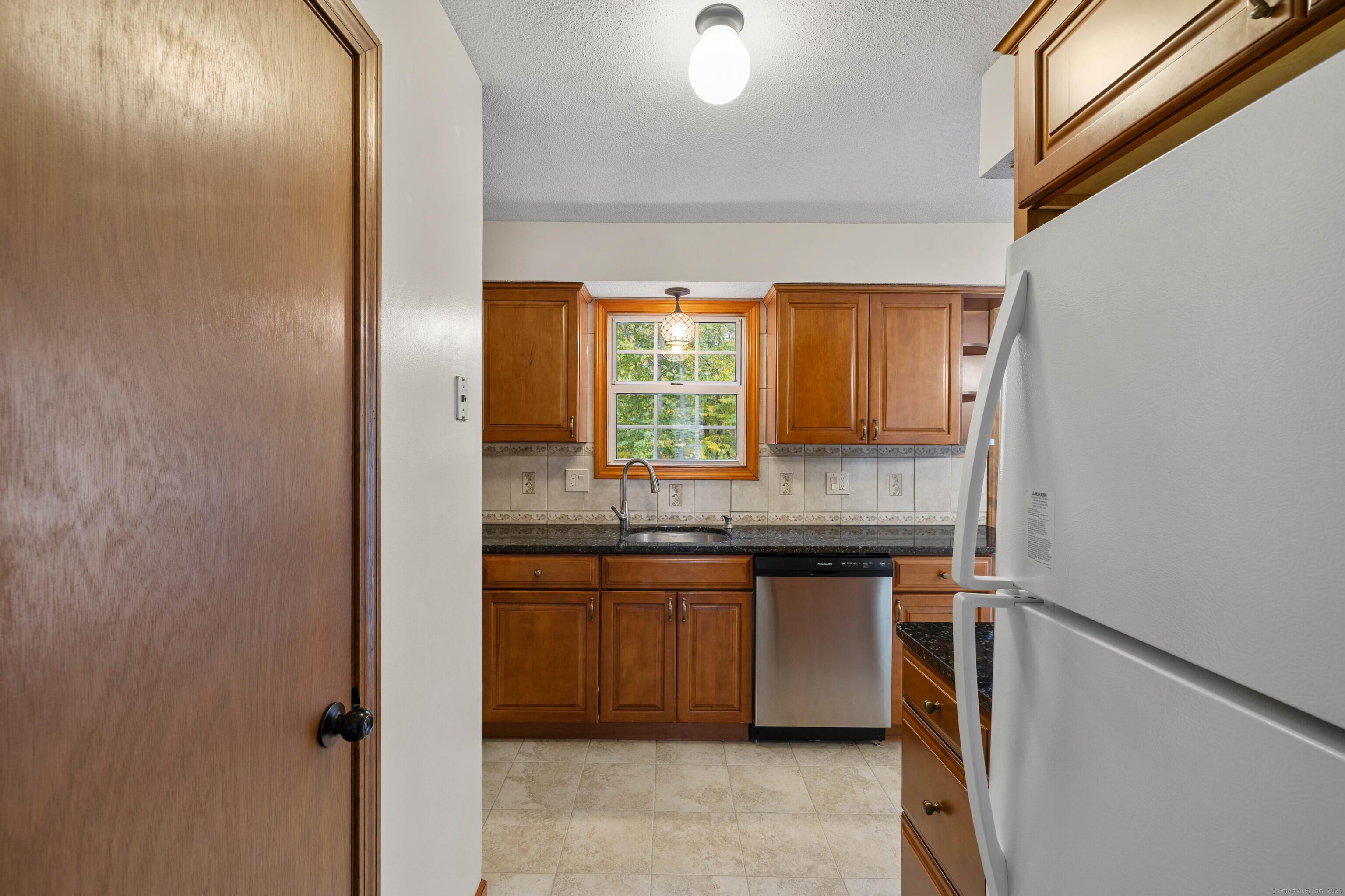 226 Austin Ryer Lane, Unit 226 Branford, CT 06405 - Photo 14 of 34 a kitchen with a sink and cabinets