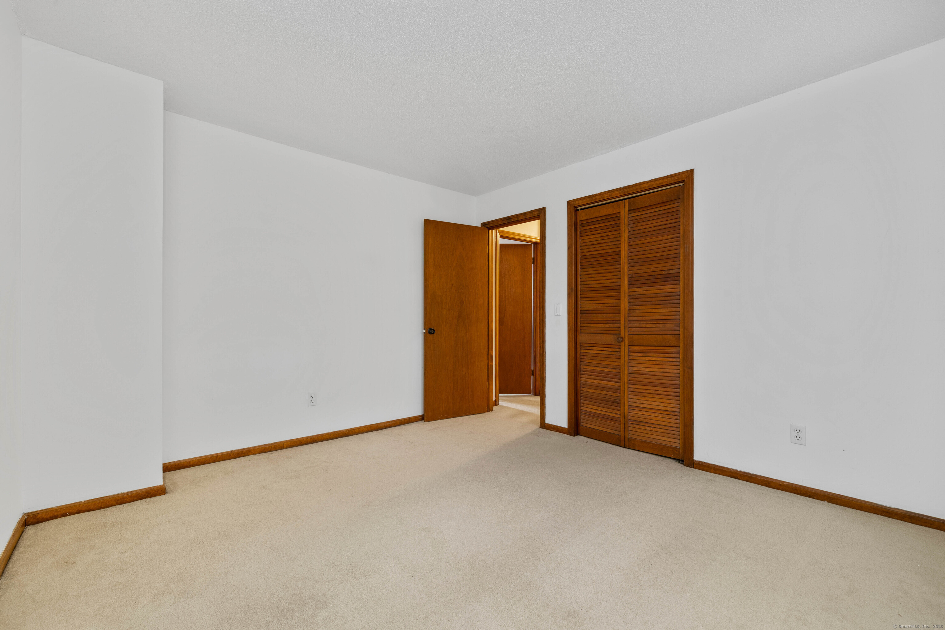 226 Austin Ryer Lane, Unit 226 Branford, CT 06405 - Photo 18 of 34 a view of an empty room with closet