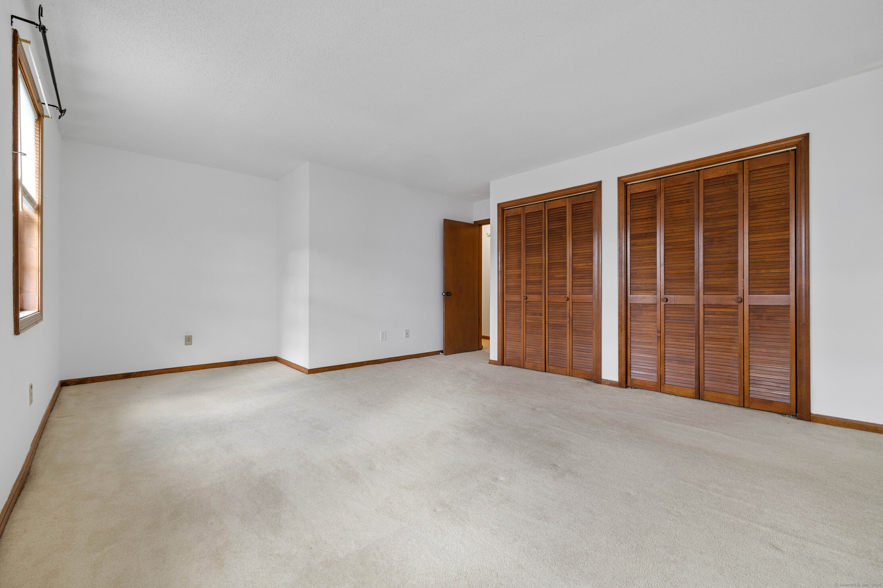 226 Austin Ryer Lane, Unit 226 Branford, CT 06405 - Photo 19 of 34 an empty room with windows