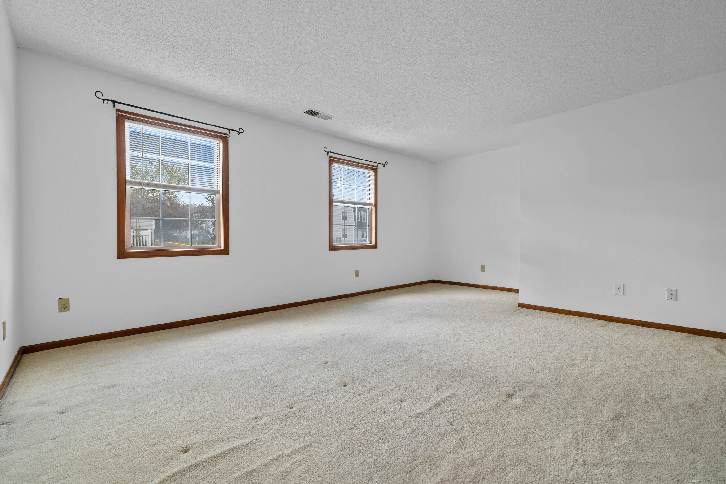 226 Austin Ryer Lane, Unit 226 Branford, CT 06405 - Photo 20 of 34 an empty room with windows