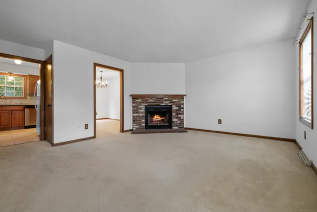 an empty room with fireplace