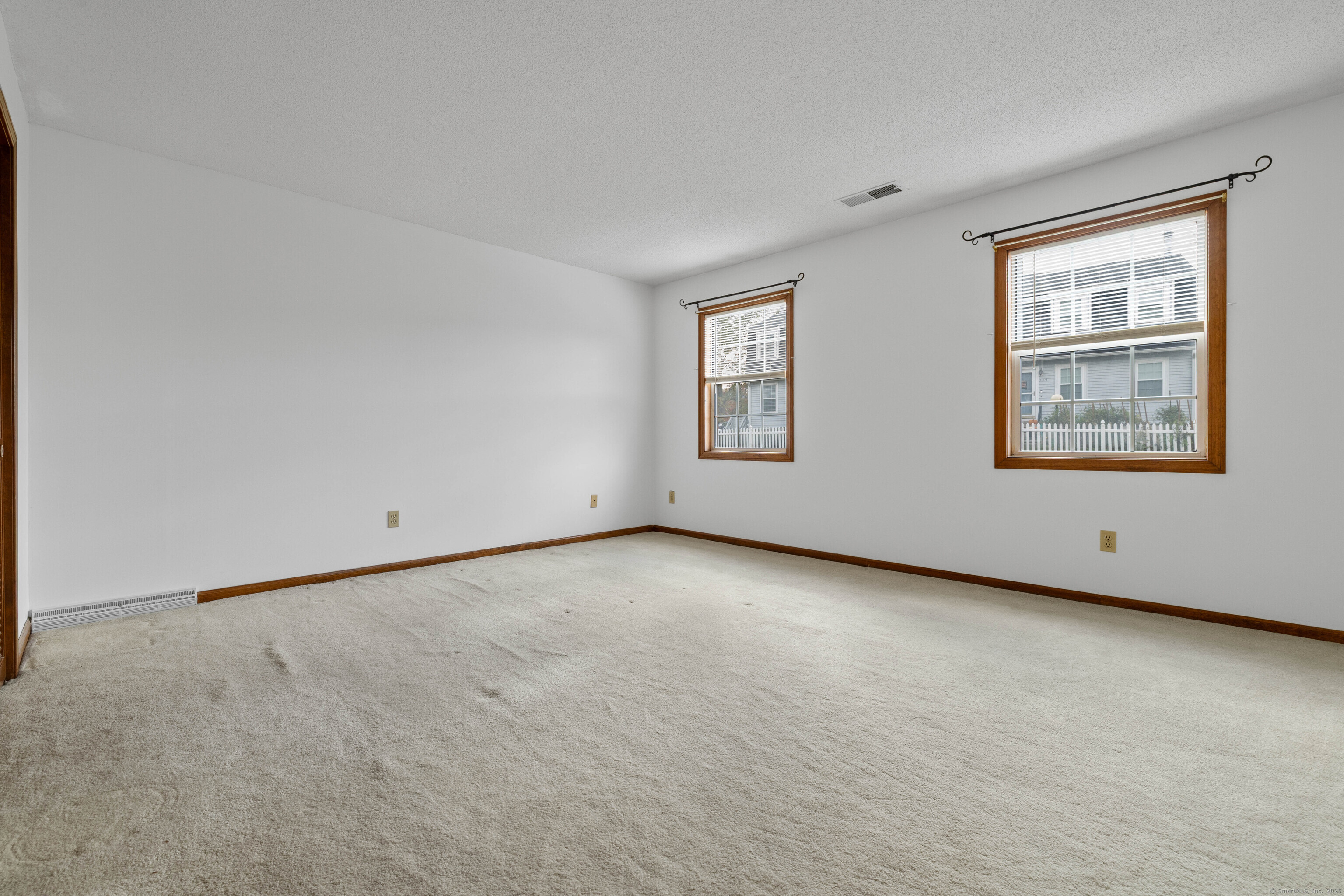 226 Austin Ryer Lane, Unit 226 Branford, CT 06405 - Photo 21 of 34 an empty room with windows