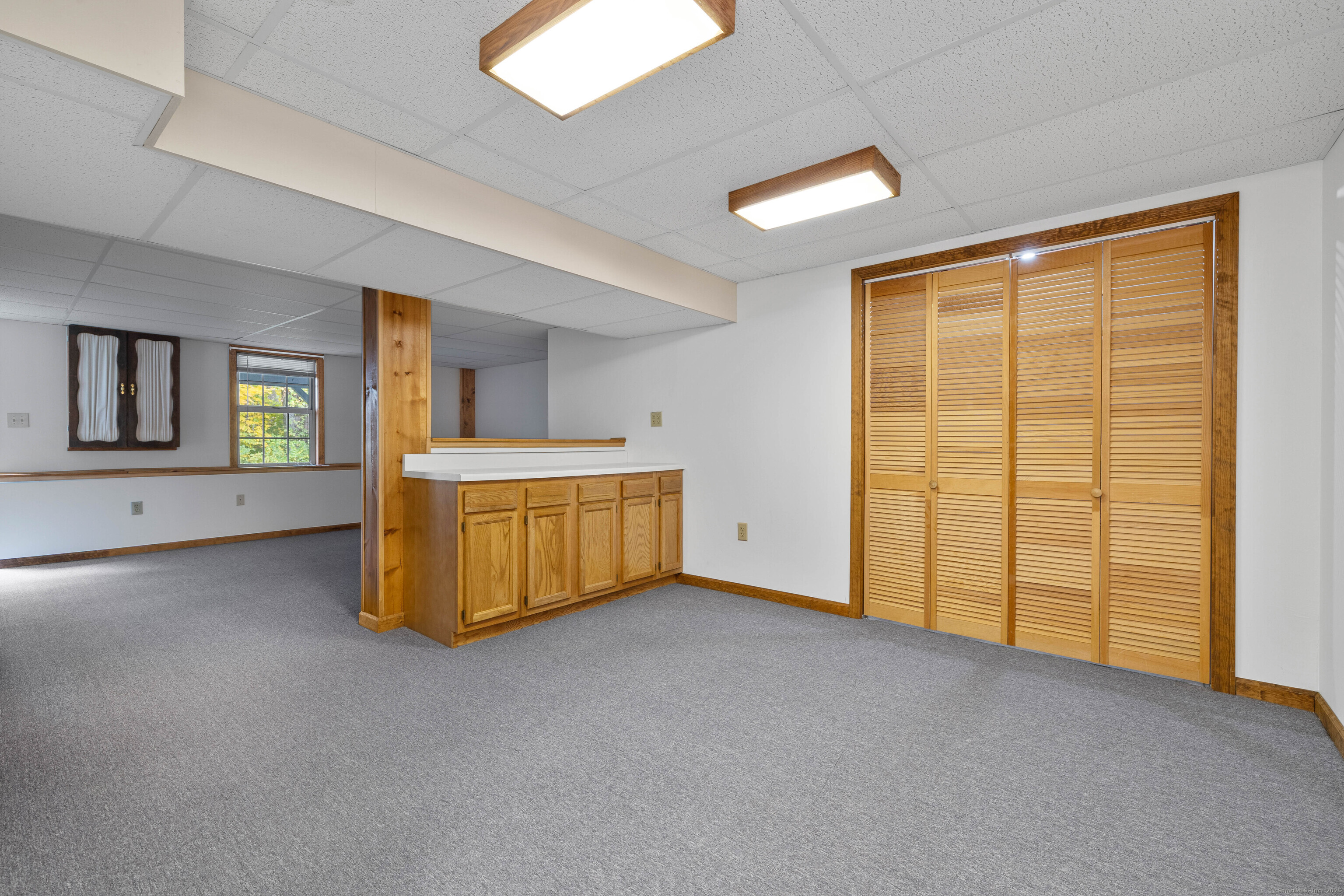 226 Austin Ryer Lane, Unit 226 Branford, CT 06405 - Photo 23 of 34 a view of an empty room with a window